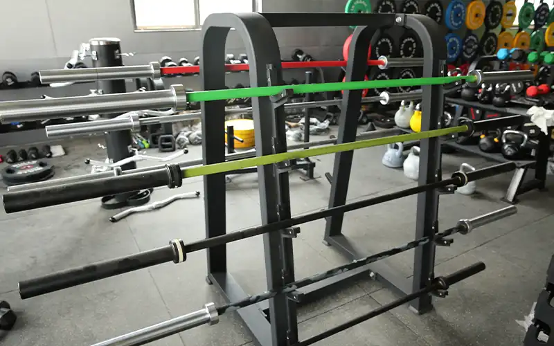 Olympic barbell bars displayed on rack showing different models