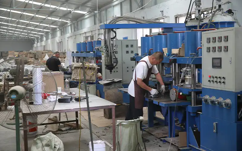 Hot press rubber coating process for barbell plates